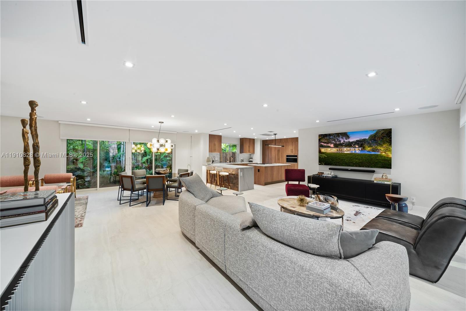 1075 Northeast 99th Street Miami Shores, FL 33138 - Photo 12 of 63 a living room with furniture and a flat screen tv