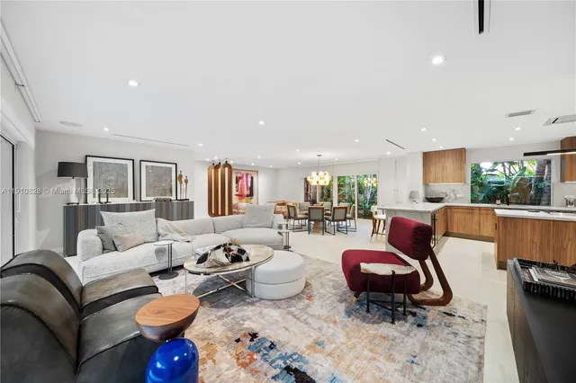 a large kitchen with stainless steel appliances lots of counter space and a table