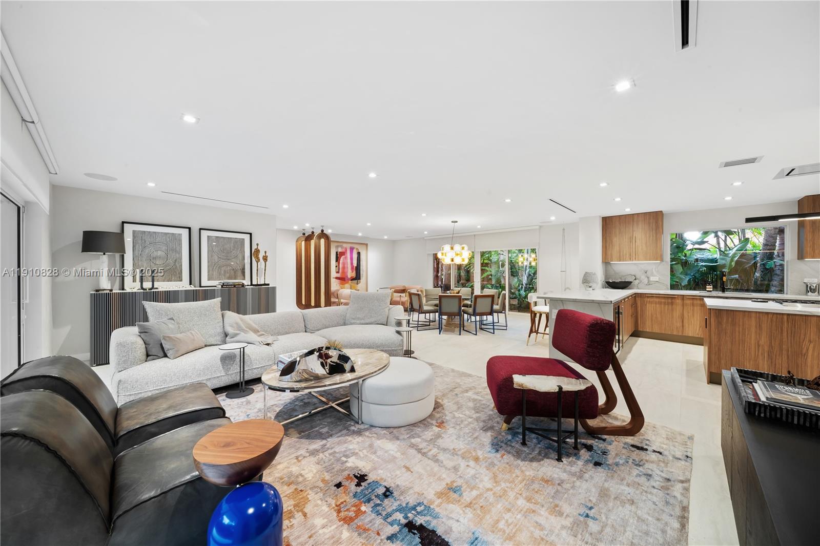 1075 Northeast 99th Street Miami Shores, FL 33138 - Photo 13 of 63 a living room with furniture fireplace and a table
