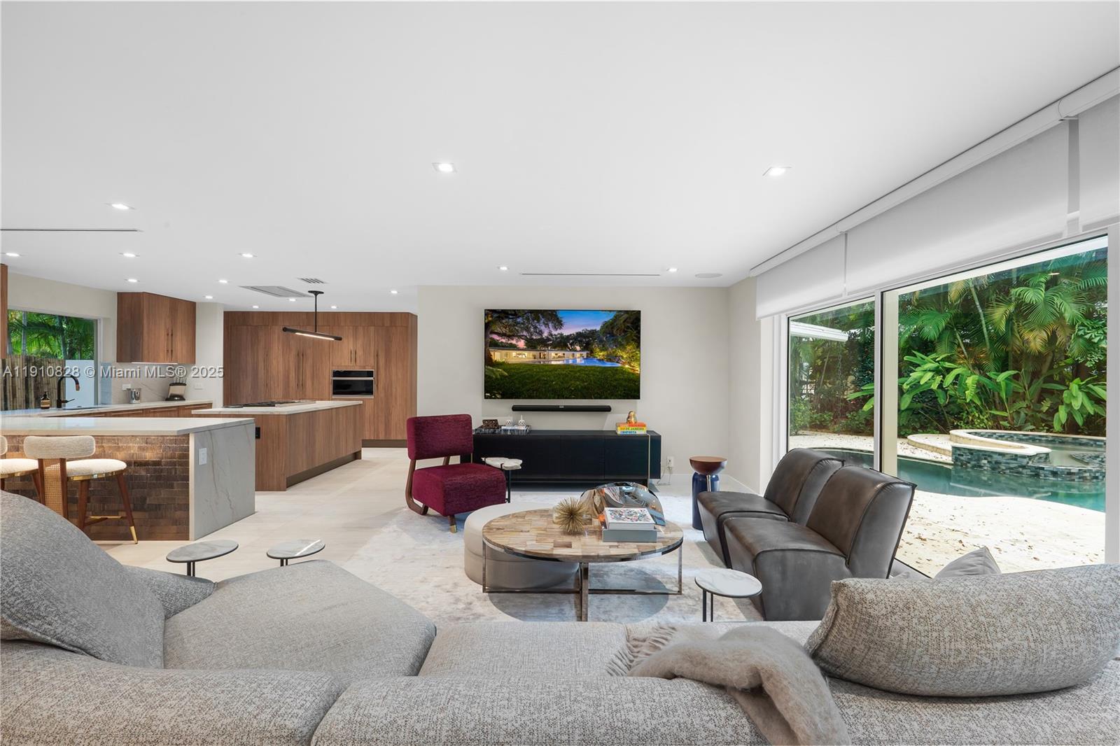 1075 Northeast 99th Street Miami Shores, FL 33138 - Photo 2 of 63 a living room with furniture and a flat screen tv