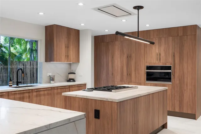 a kitchen with a stove and a refrigerator