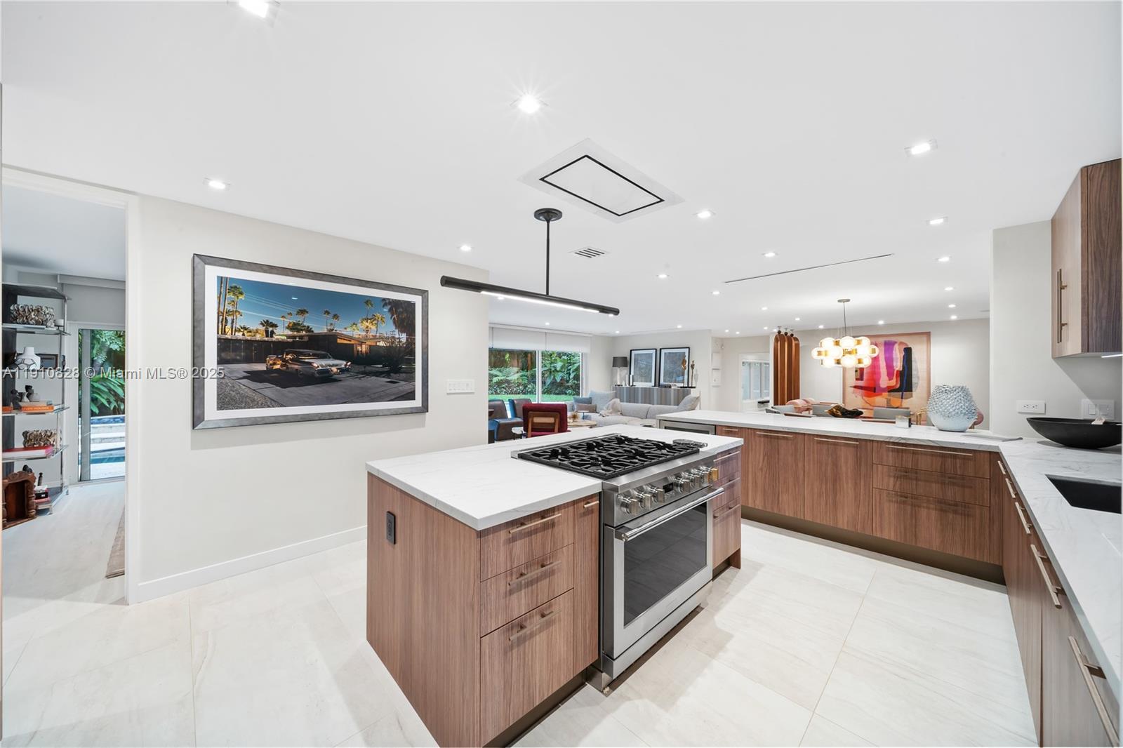 1075 Northeast 99th Street Miami Shores, FL 33138 - Photo 23 of 63 a kitchen with stainless steel appliances granite countertop a stove and a sink