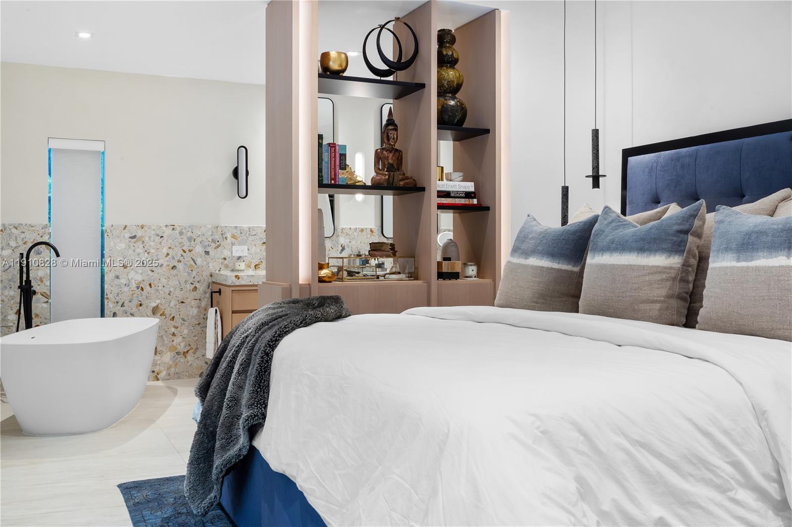 1075 Northeast 99th Street Miami Shores, FL 33138 - Photo 28 of 63 a bedroom with bed and a couch