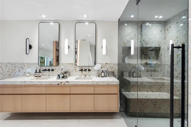 a bathroom with a toilet and a mirror