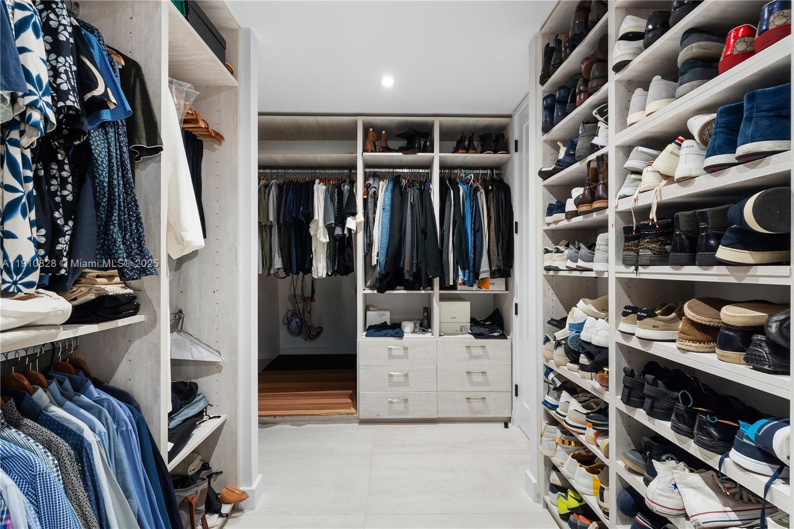 1075 Northeast 99th Street Miami Shores, FL 33138 - Photo 35 of 63 a view of walk in closet with clothes and shoes