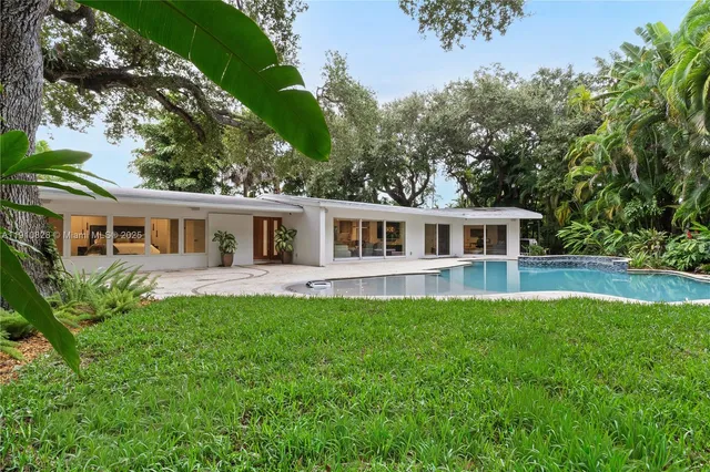 a view of a house with swimming pool
