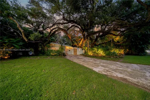 a bedroom with a large bed and a large window
