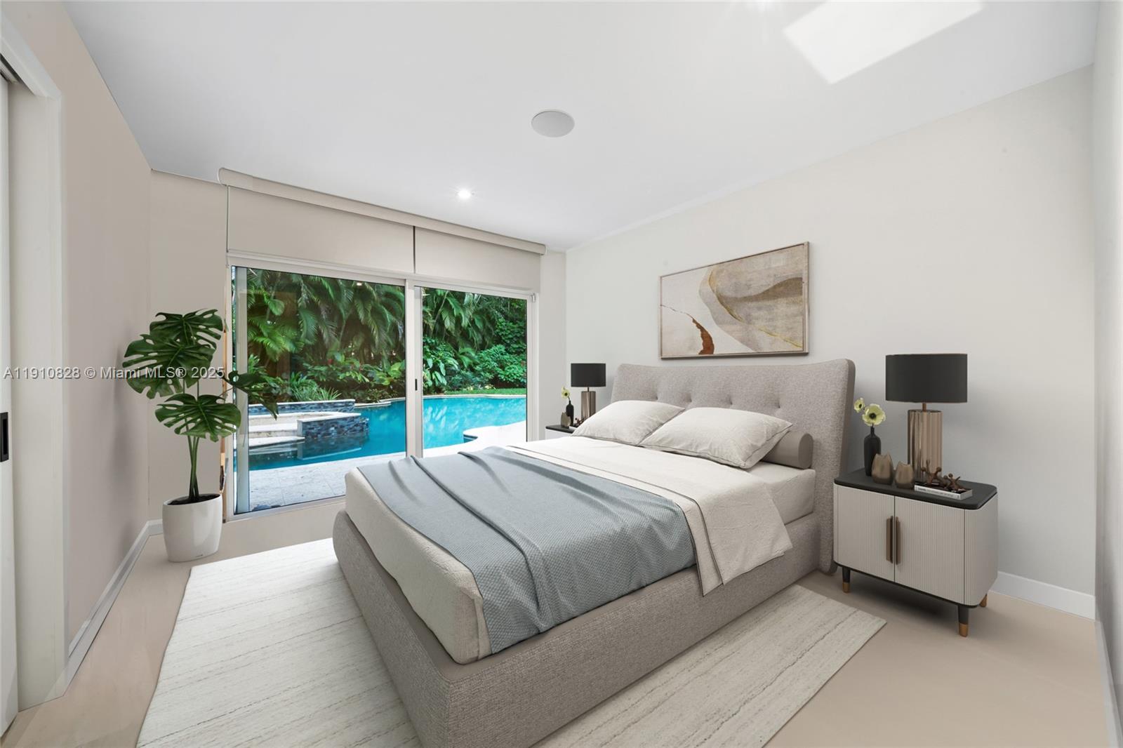 1075 Northeast 99th Street Miami Shores, FL 33138 - Photo 54 of 63 a bedroom with a large bed and a large window