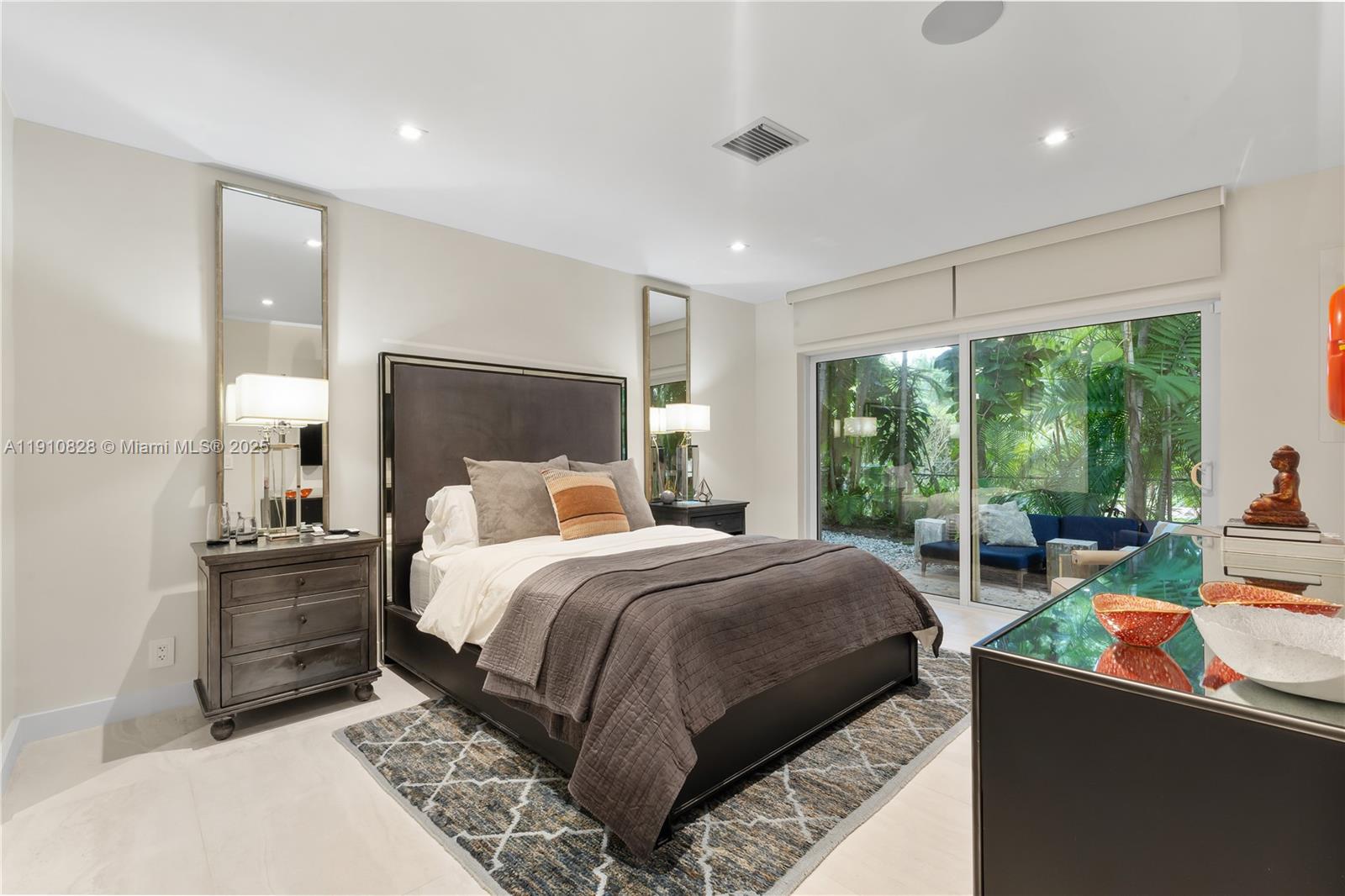 1075 Northeast 99th Street Miami Shores, FL 33138 - Photo 55 of 63 a bed room with a bed and a couch