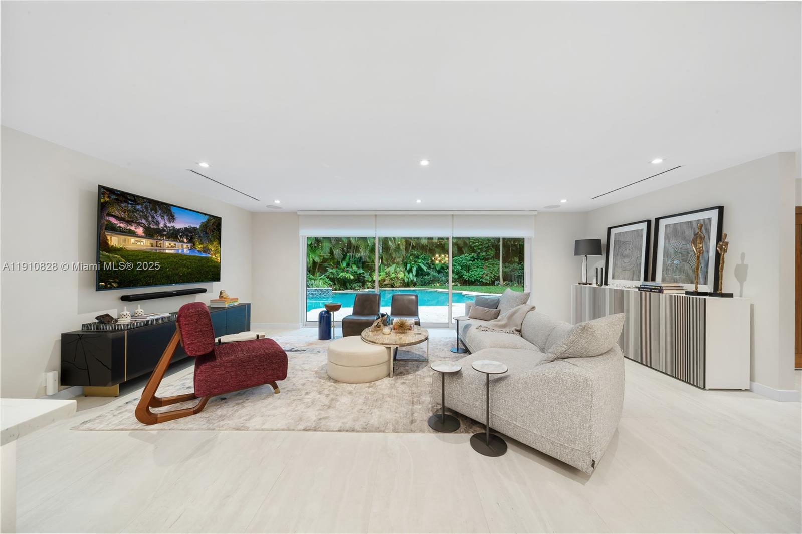 1075 Northeast 99th Street Miami Shores, FL 33138 - Photo 10 of 63 a living room with furniture and a flat screen tv