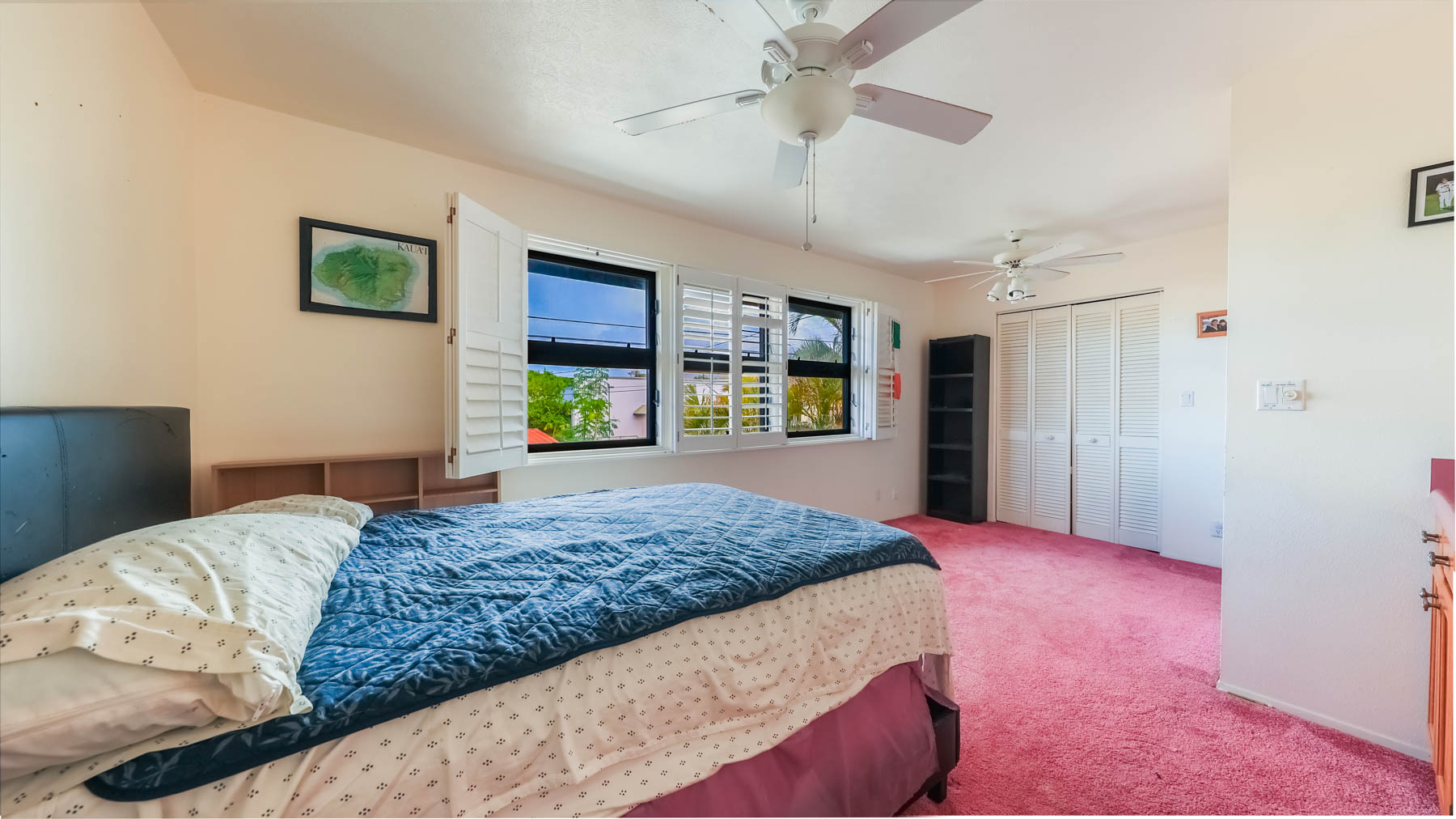 4478 Panako Road Waimea, HI 96796 - Photo 4 of 12 a bedroom with a large bed a flat tv screen and dresser