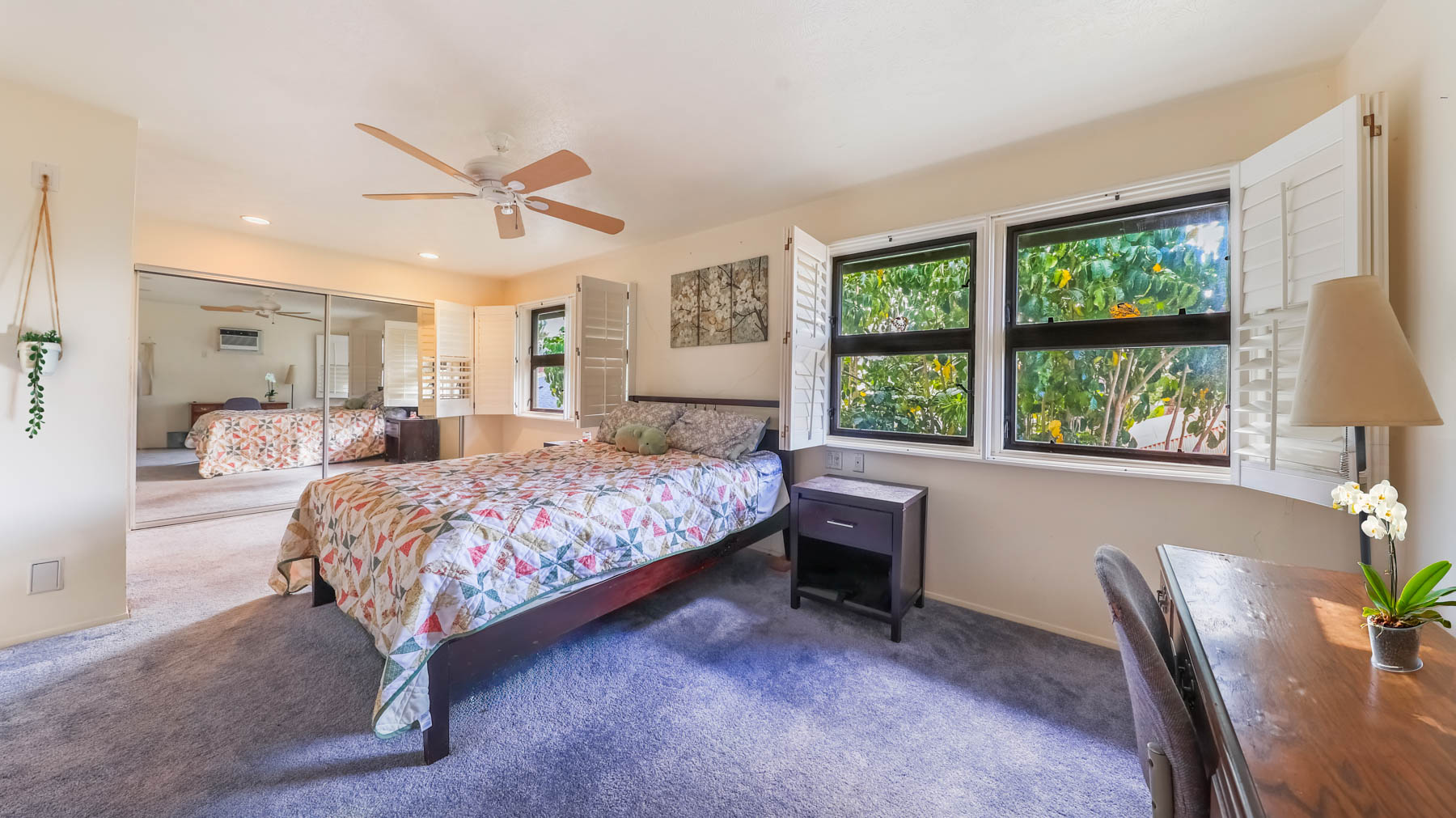 4478 Panako Road Waimea, HI 96796 - Photo 7 of 12 a bedroom with a large bed and a chandelier