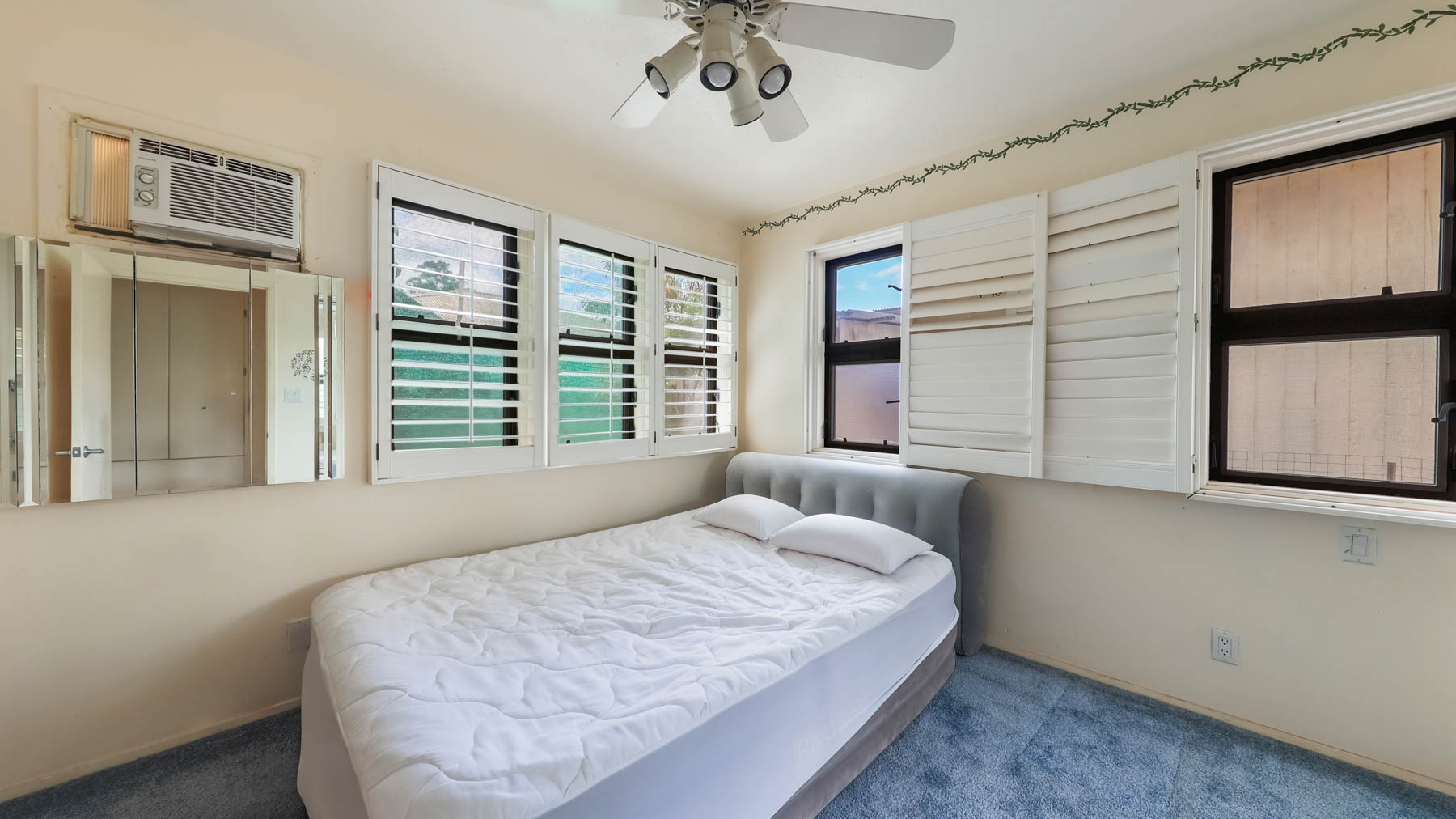 4478 Panako Road Waimea, HI 96796 - Photo 8 of 12 a bedroom with a large bed and a window