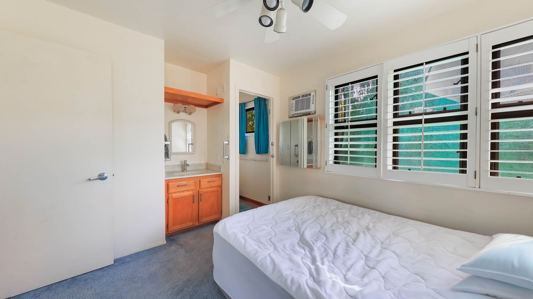 4478 Panako Road Waimea, HI 96796 - Photo 9 of 12 a bedroom with a bed and a dresser next to a window