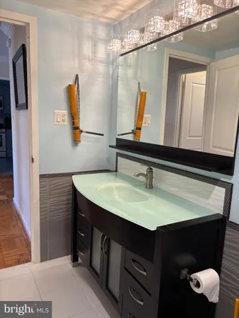 a bathroom with a sink and a mirror