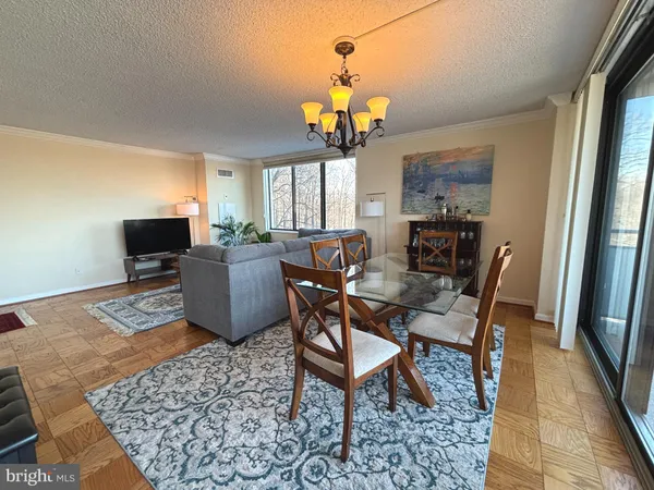 a view of a dining room with furniture and window