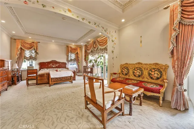 a bedroom with furniture and a window