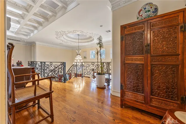 a very nice looking room with wooden floor and furniture