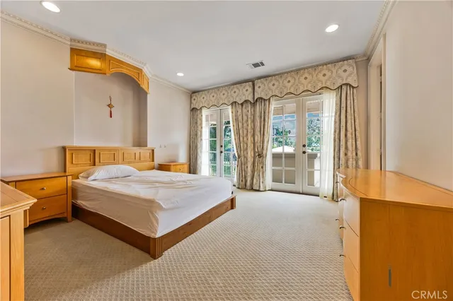 a front view of a building with a garden