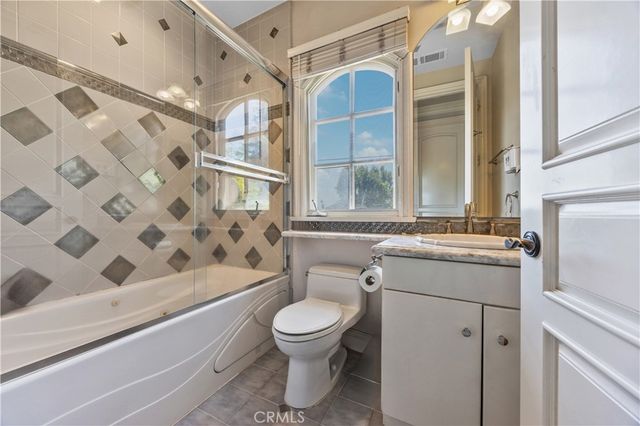 front view of a house with a garden