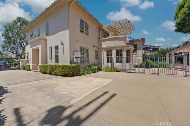 a view of a patio with a table and chairs