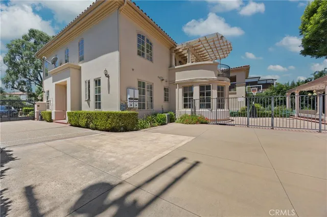 a view of a patio with a table and chairs