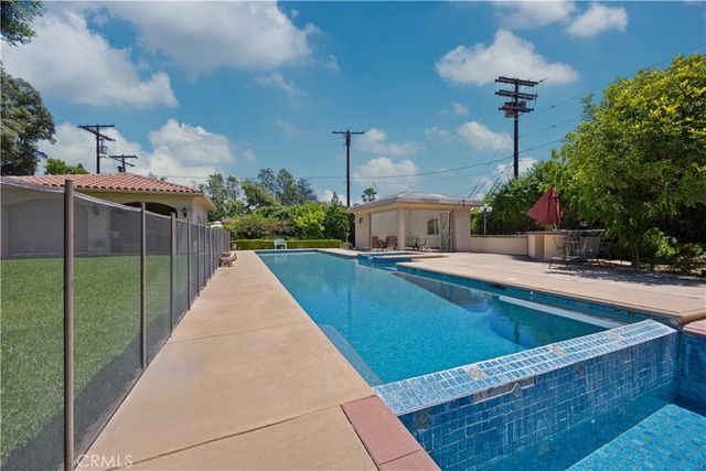 a view of living room with furniture and a fireplace
