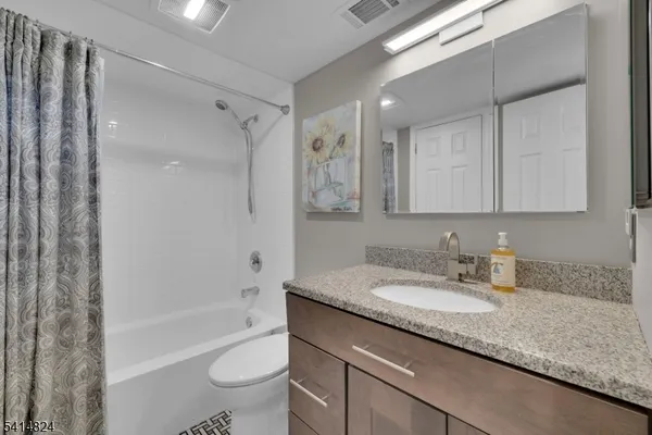 a view of a green field with clear sky