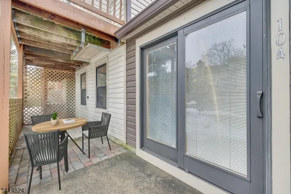 a view of a backyard with a patio and swimming pool
