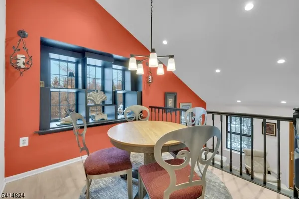 a kitchen with stainless steel appliances granite countertop a sink and a refrigerator