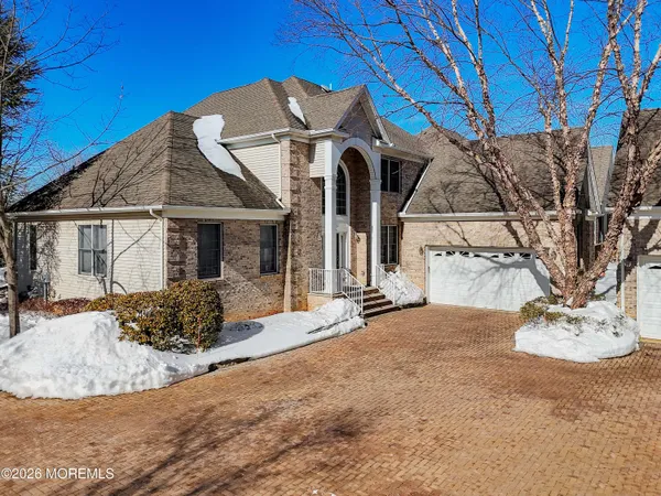 a view of a house with a snow in the yard
