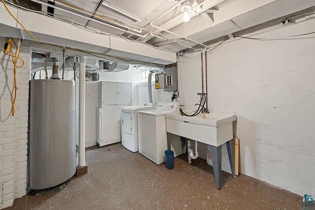 122 3rd Street Cloquet, MN 55720 - Photo 25 of 42 Laundry area featuring a utility sink, washing machine, and dryer