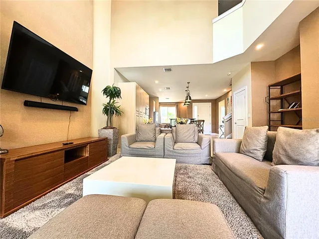 a kitchen view of a stove and a chairs