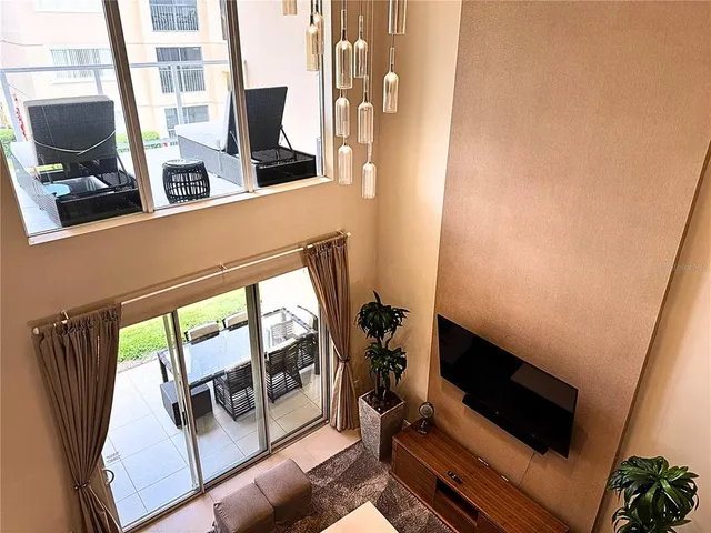 a living room with a table and a rug