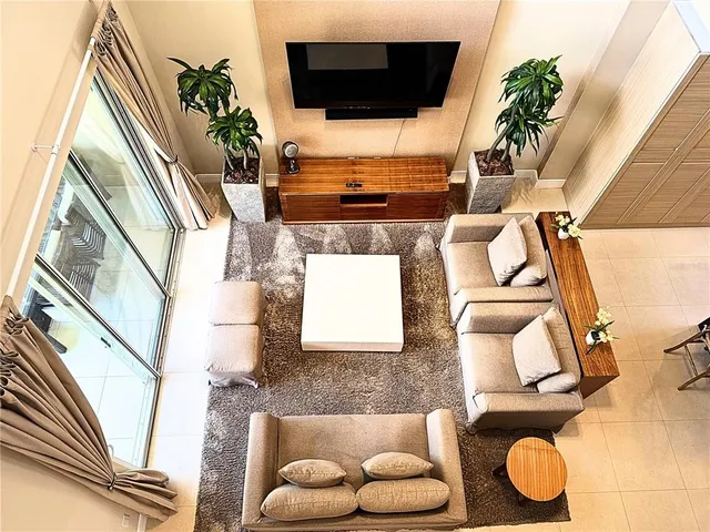 a bathroom with a tub mirror and sink