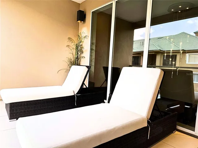 a bedroom with two beds and a flat screen tv