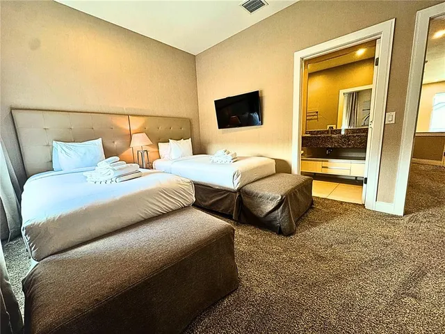 a living room with a bed and furniture