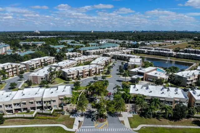 a view of a house with swimming pool and sitting area