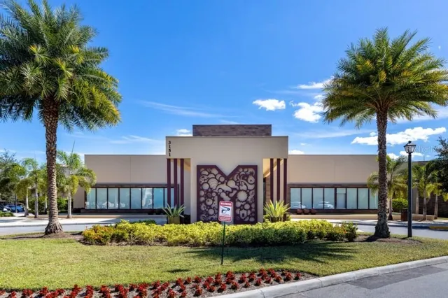 a swimming pool with outdoor seating and yard