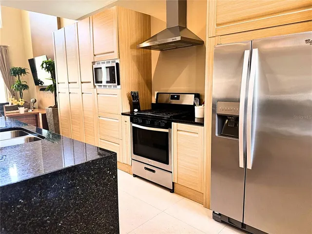 a living room with furniture a rug and a large window