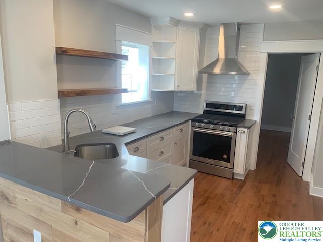 303 East Church Street, Unit A Bethlehem, PA 18018 - Photo 5 of 25 a kitchen with stainless steel appliances granite countertop a sink stove and refrigerator