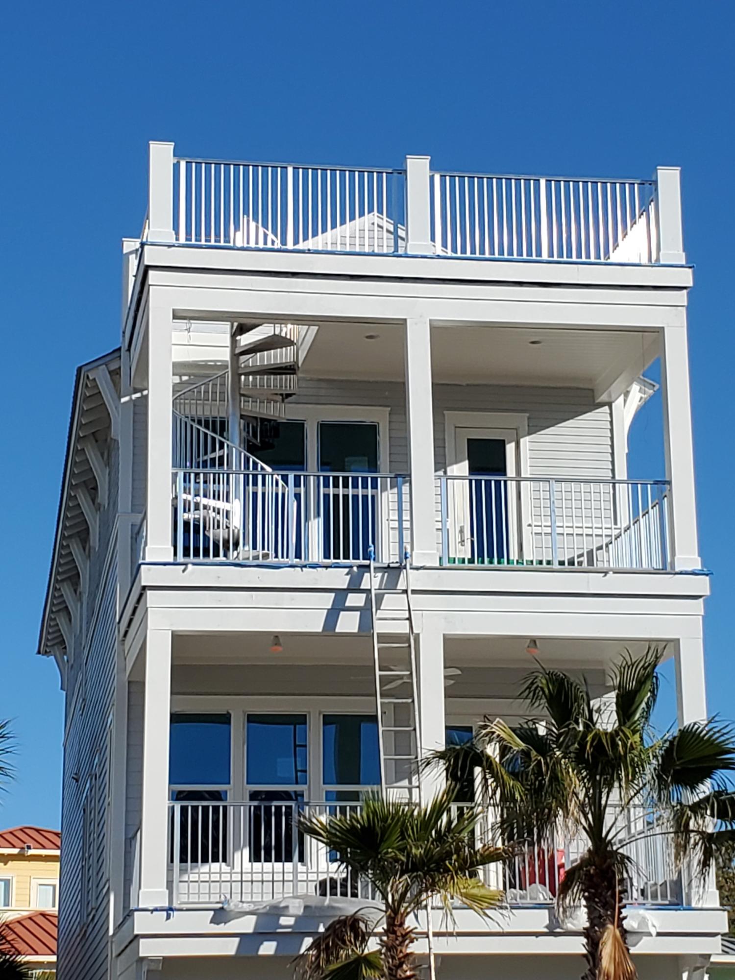 a view of front door of house with potted plants