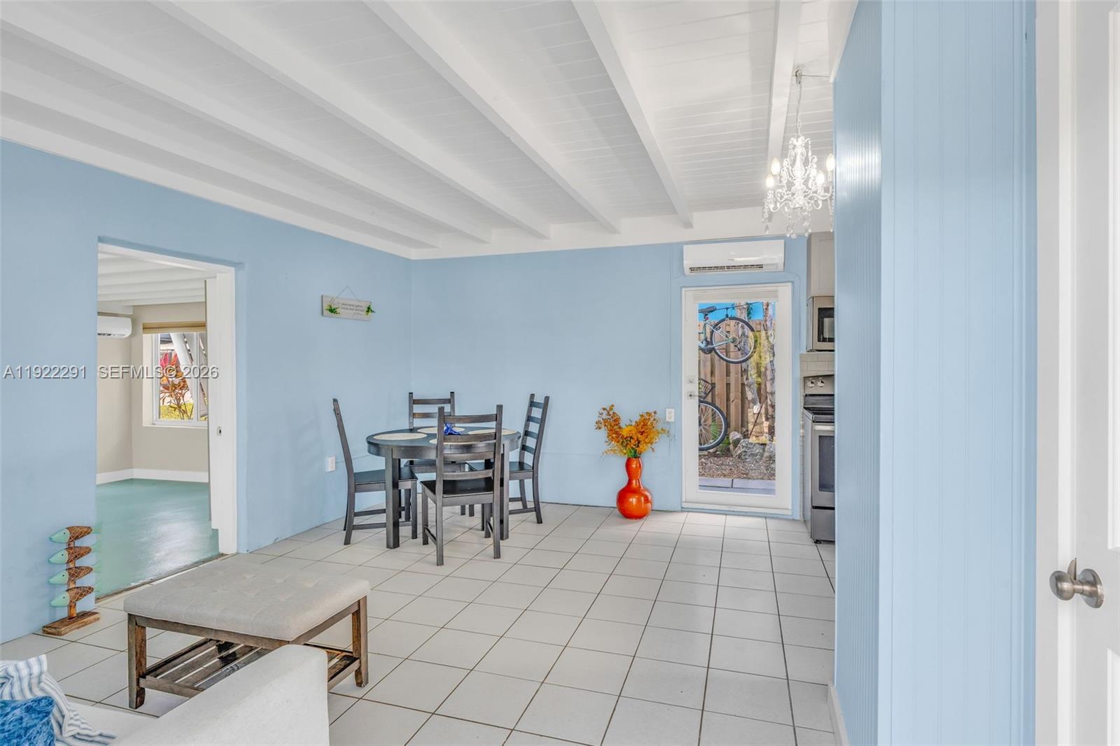 40 Pirates Drive Key Largo, FL 33037 - Photo 11 of 38 a view of a dining room with furniture and chandelier