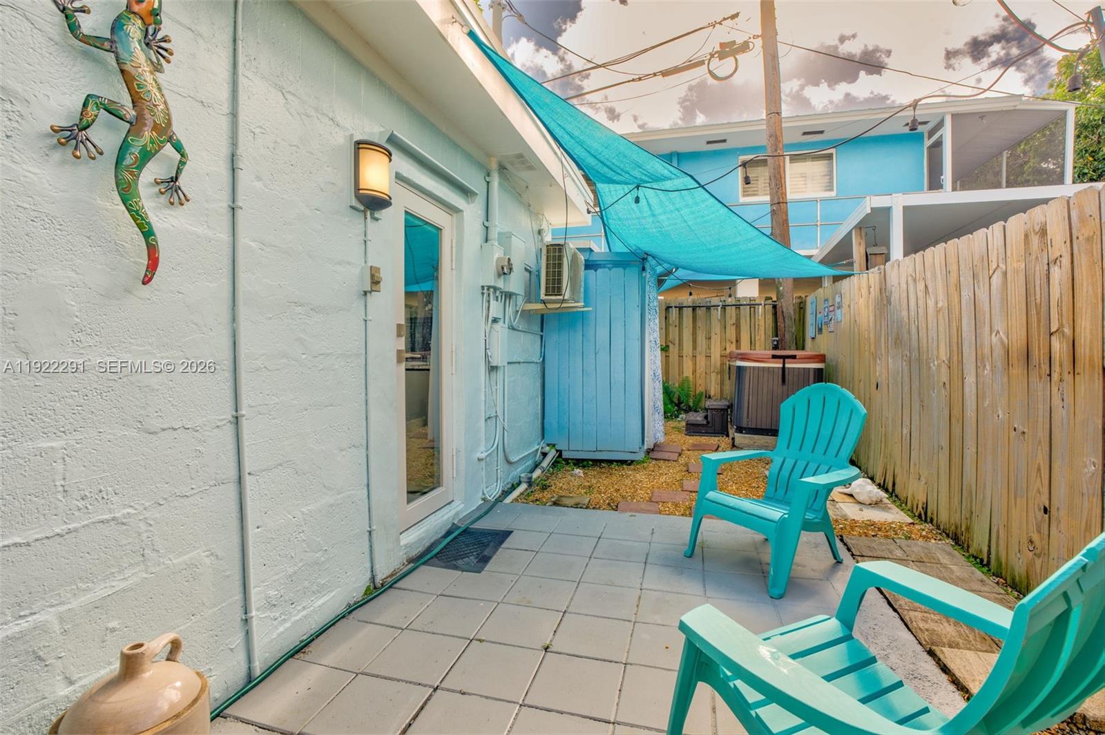 40 Pirates Drive Key Largo, FL 33037 - Photo 26 of 38 a backyard of a house with seating space