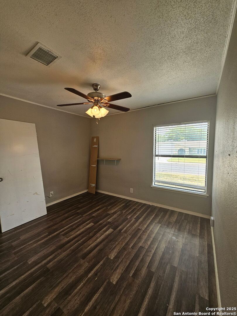 5303 Walnut Vista Drive San Antonio, TX 78247 - Photo 12 of 18 a view of an empty room with wooden floor and a window