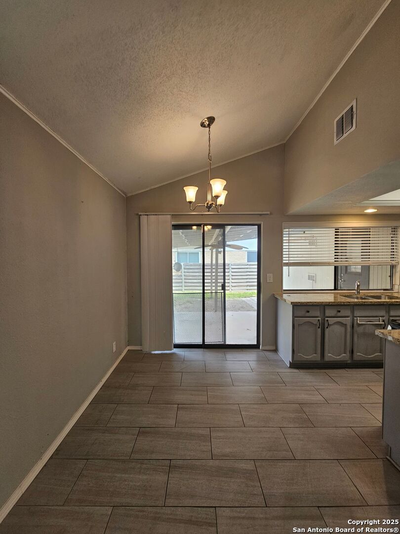 5303 Walnut Vista Drive San Antonio, TX 78247 - Photo 5 of 18 a view of a kitchen with a sink and a window