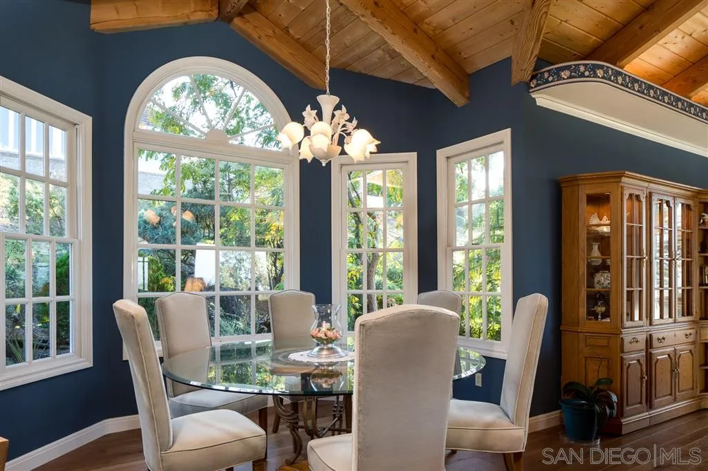 12966 Lomas Verdes Drive Poway, CA 92064 - Photo 14 of 25 a view of a dining room with furniture a chandelier and wooden floor