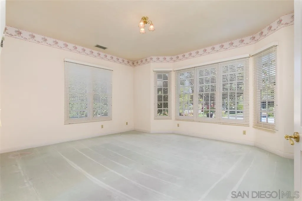 12966 Lomas Verdes Drive Poway, CA 92064 - Photo 16 of 25 a view of an empty room with a window