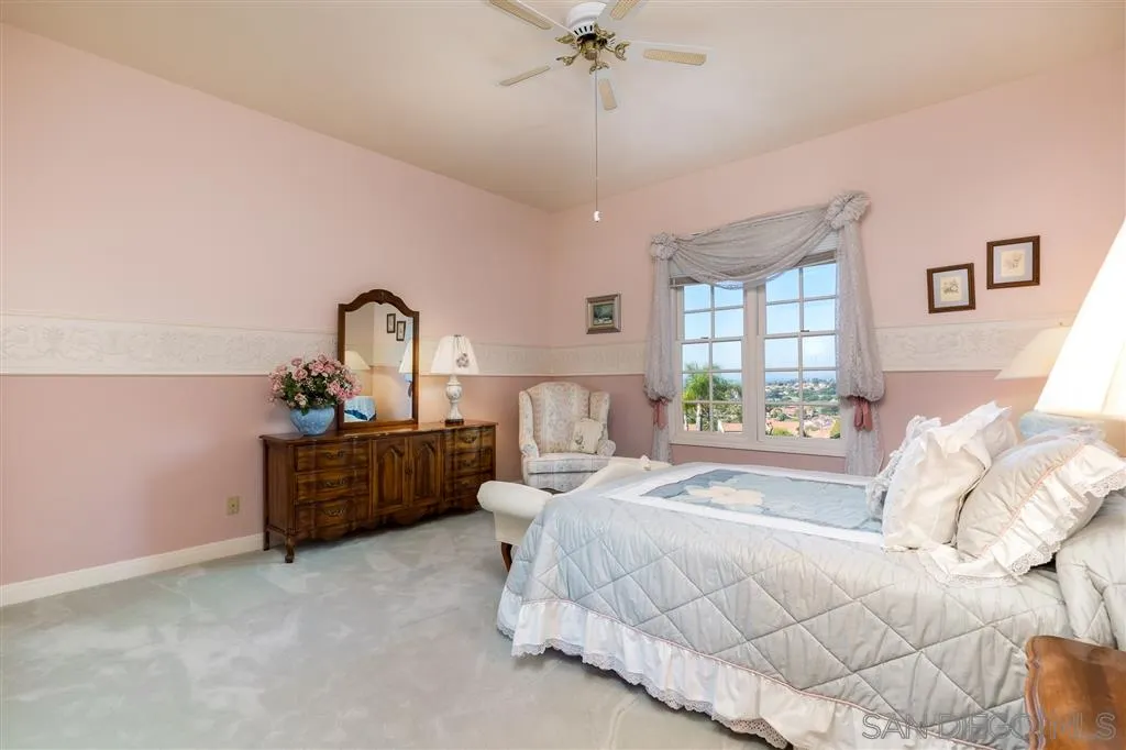 12966 Lomas Verdes Drive Poway, CA 92064 - Photo 17 of 25 a bedroom with bed and window