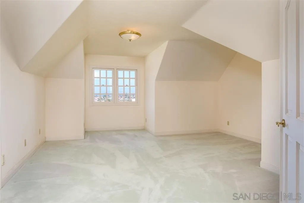 12966 Lomas Verdes Drive Poway, CA 92064 - Photo 19 of 25 an empty room with windows